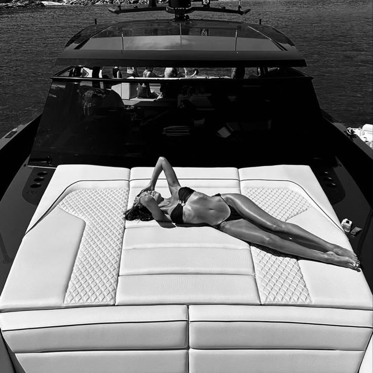 Black and white editorial photograph on a luxury yacht deck